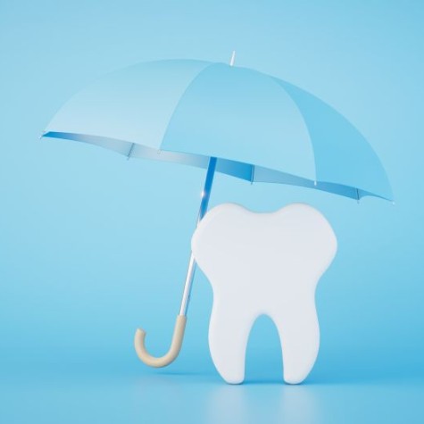 Tooth model under a blue umbrella