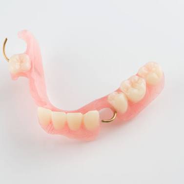 Partial denture against neutral background