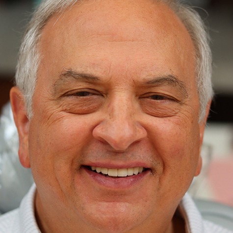 Smiling Landmark Dental Studio patient with attractive teeth