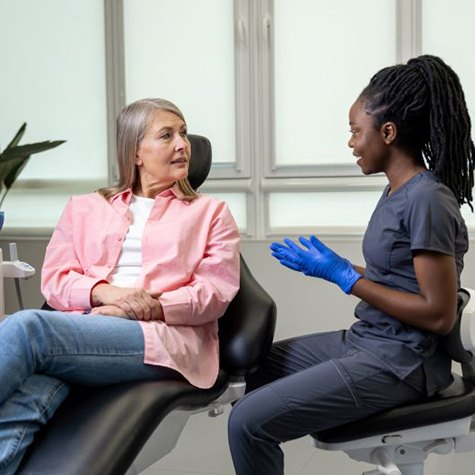Patient and dental team member talking during consultation