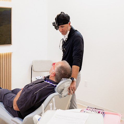 Dentist at Landmark Dental Studio speaking with patient