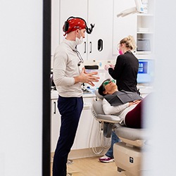 Dentist and patient at Landmark Dental Studio engage in conversation