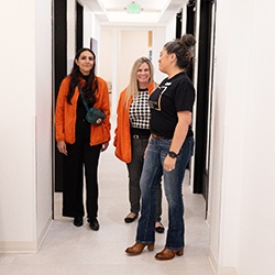 Happy people talking inside Landmark Dental Studio