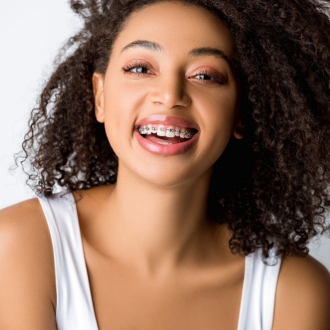 teen smiling with traditional braces
