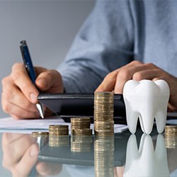 Person budgeting for the cost of dental care