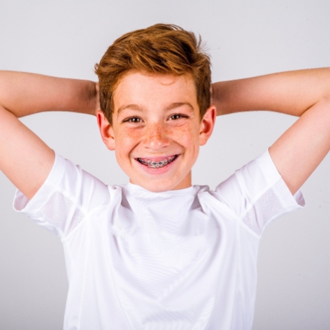 Happy young boy with braces