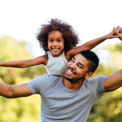 Dad and daughter playing outside