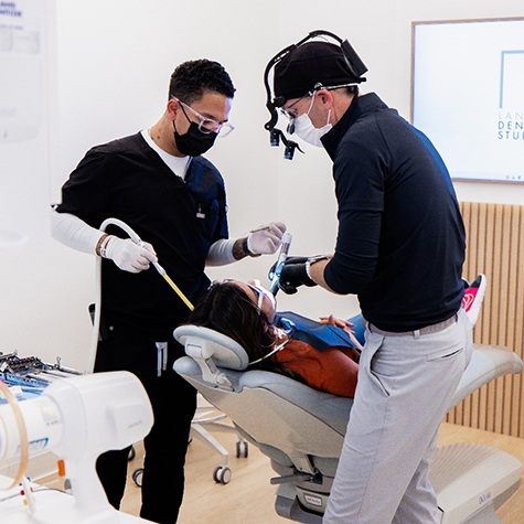Landmark Dental Studio team working on patient