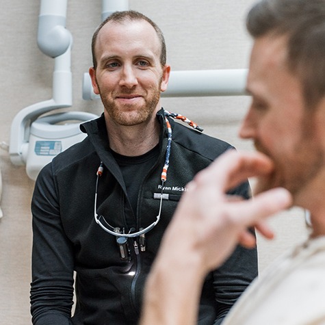 Dr. Mickle listening as patient explains his concerns?