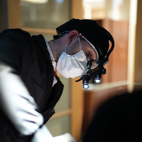 Landmark Dental Studio dentist carefully working on patient